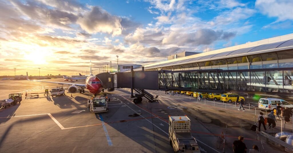 pexels-photo-2026324-2026324 A vibrant sunset at Copenhagen Airport with airplanes and bustling activity.