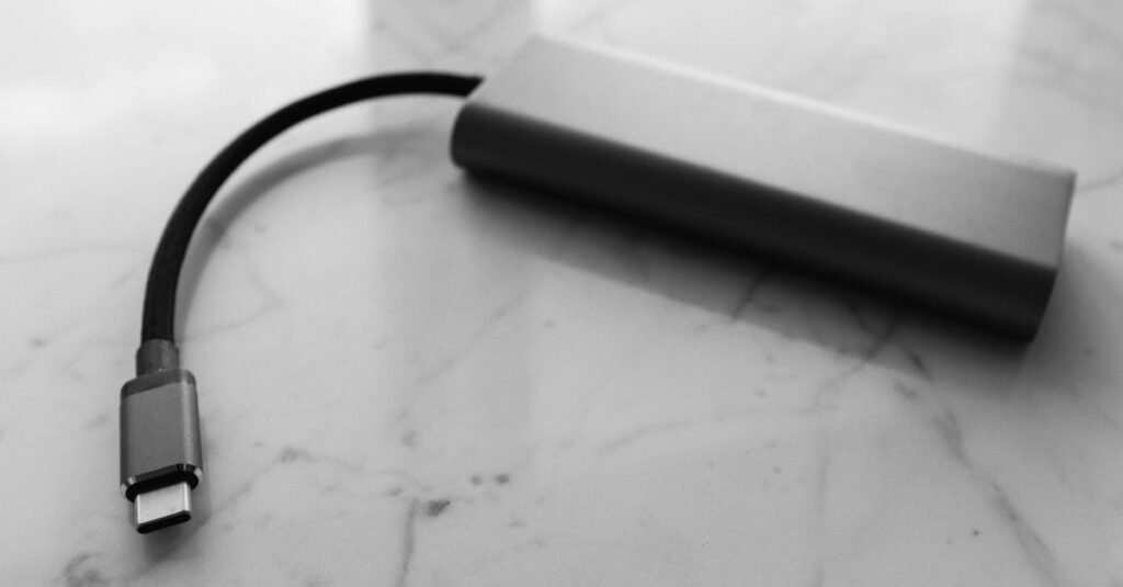 pexels-photo-3921705-3921705 A minimalist black and white image of a USB-C power bank on a marble surface.
