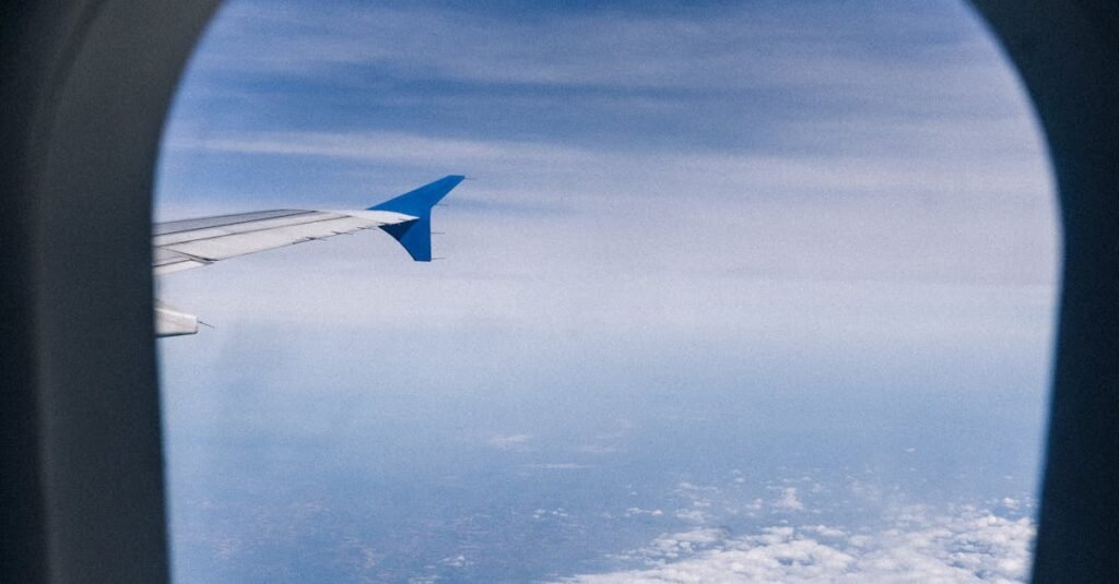 pexels-photo-7261667-7261667 View of clouds and sky from an airplane window, showcasing travel scenery.